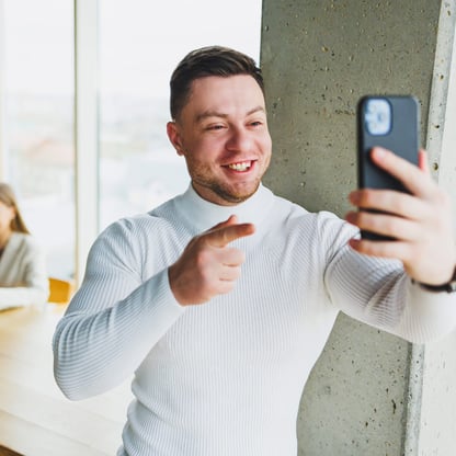 employee filming takeover video on cellphone