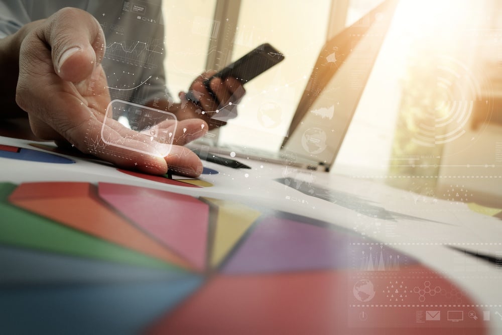 Image of a phone and person next to a color wheel