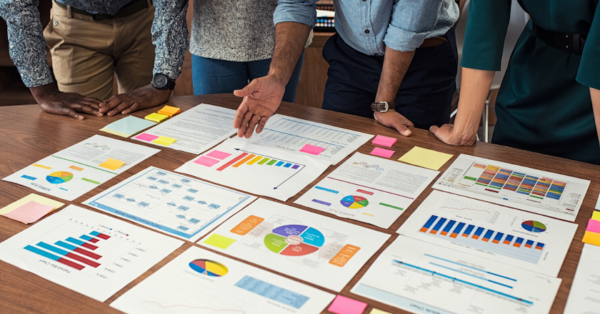 Image of people looking for marketing reports