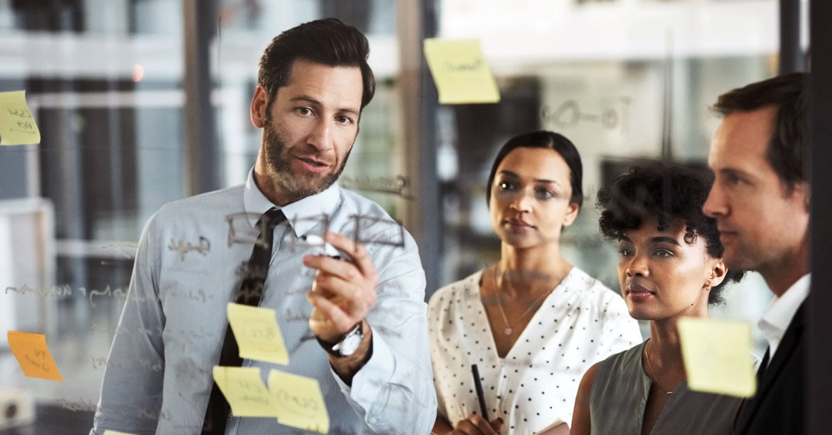 team-using-sticky-note-board-to-analyze-website-data
