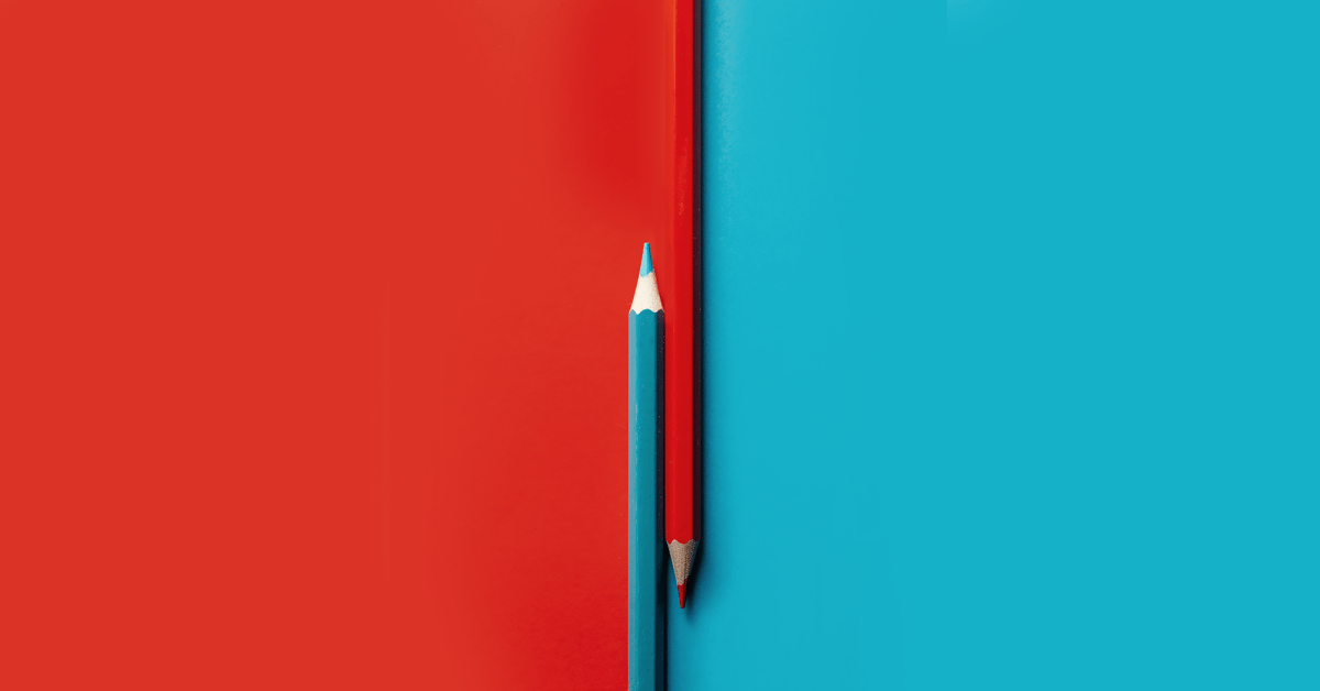 Two different pencils splitting an multi-colored background.