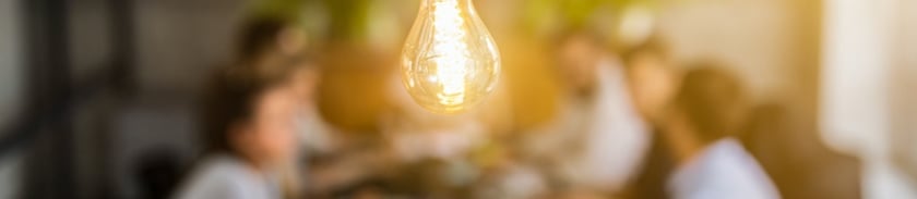 lightbulb and holistic marketing approach meeting