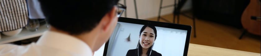 man and woman conducting virtual interview
