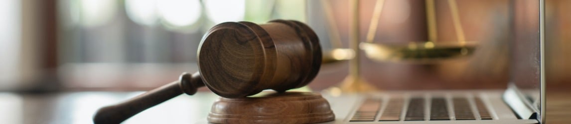 Gavel and laptop.