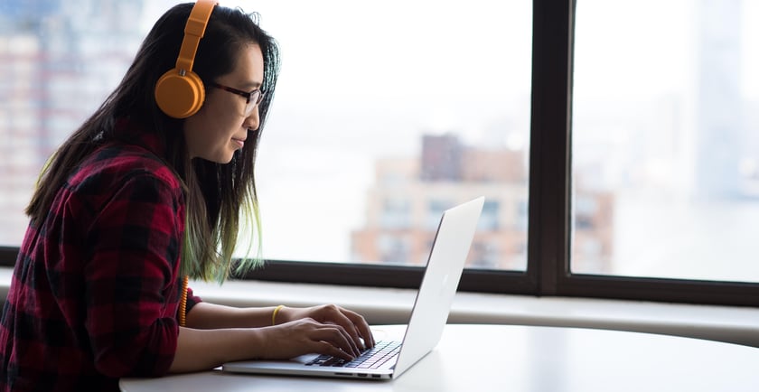 Listening to a webinar on a laptop