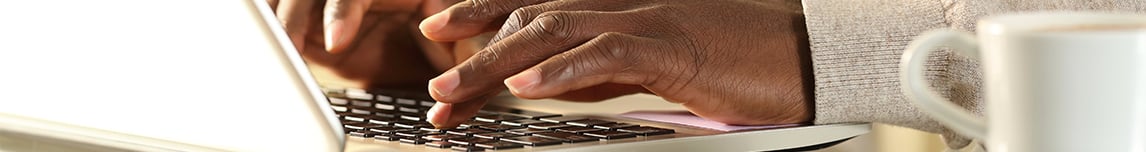 hands-typing-on-laptop