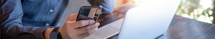 Man-on-cellphone-and-computer