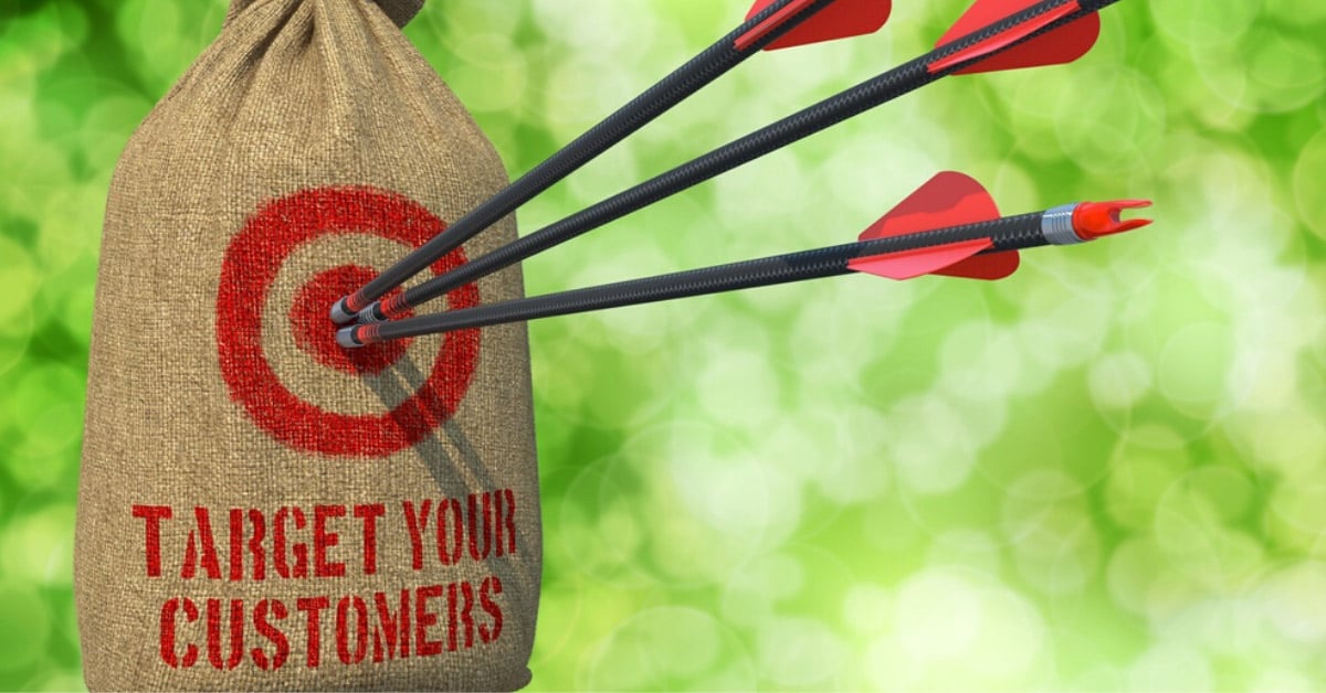 Three Arrows Hit in Red Target on a Hanging Sack on Green Bokeh Background