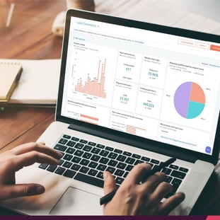 woman on laptop looking at HubSpot dashboard