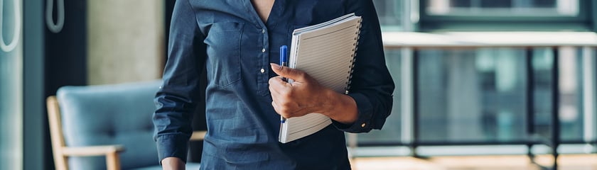 Marketer holding a notepad and pen