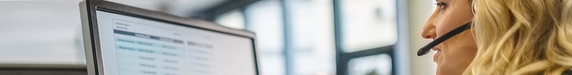 Woman-looking-at-CRM-on-computer-screen