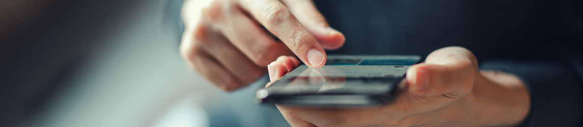 woman-looks-at-her-phone