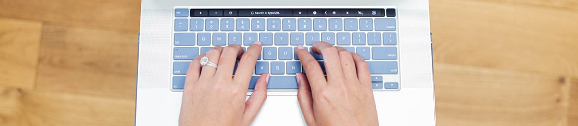 female-hands-typing-on-laptop-keyboard
